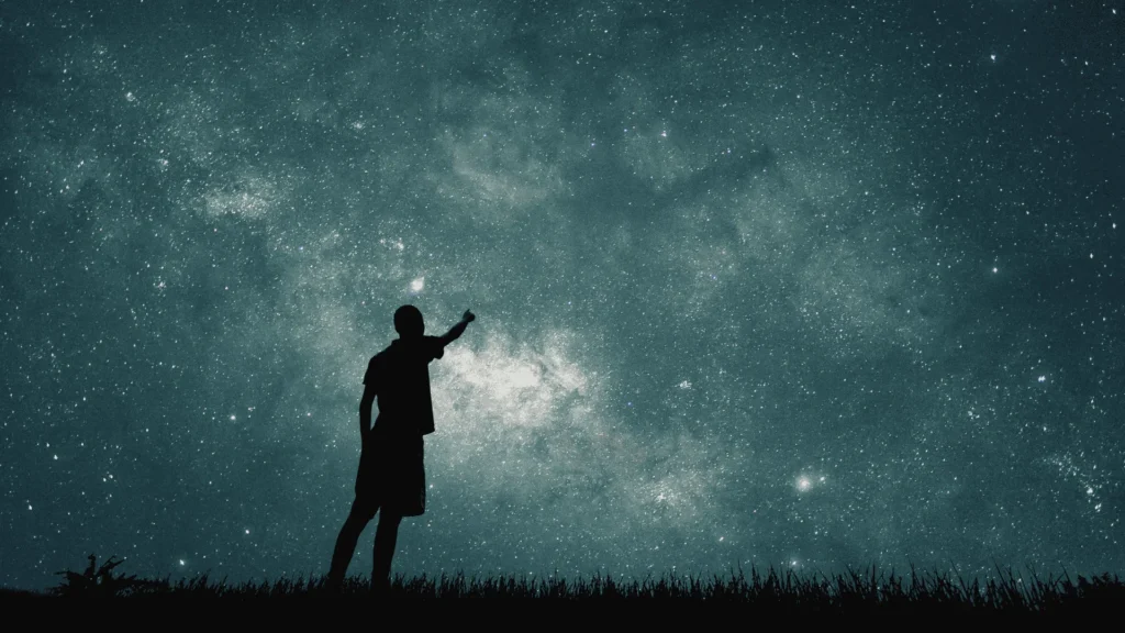 man looking at stars
