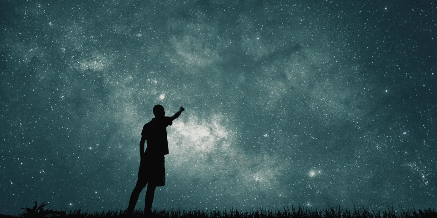 man looking at stars